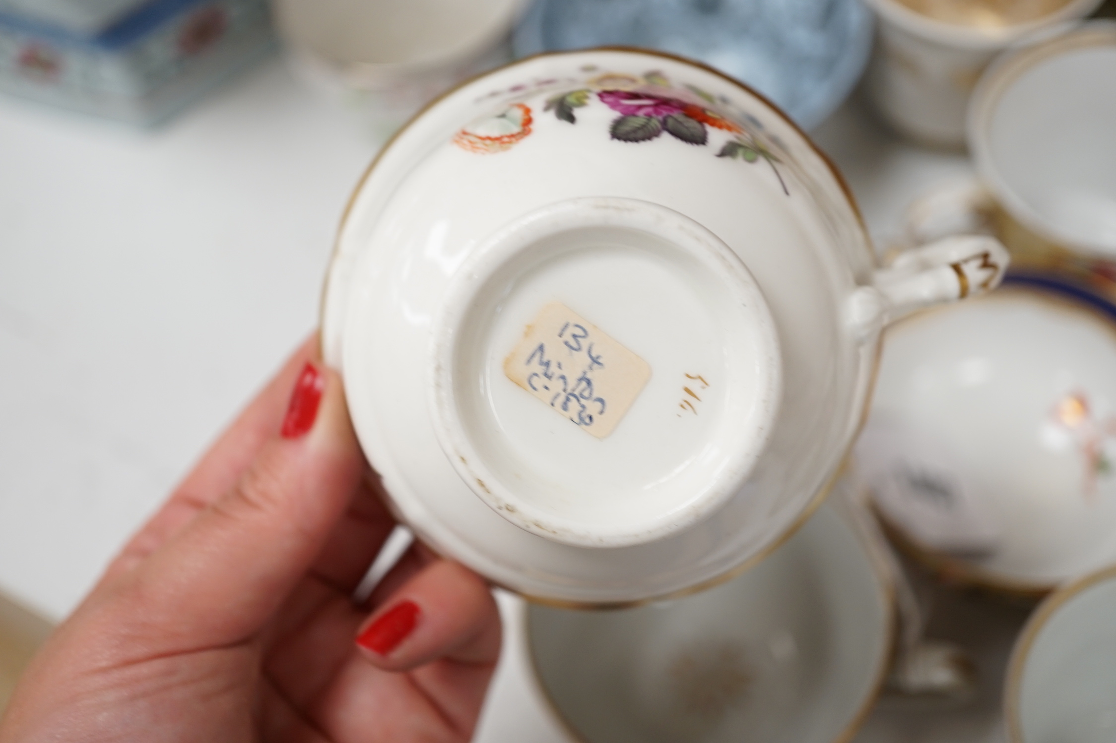 A group of Regency and Victorian porcelain tea, coffee cups and saucers, Newhall, Chamberlains, Coalport, etc.